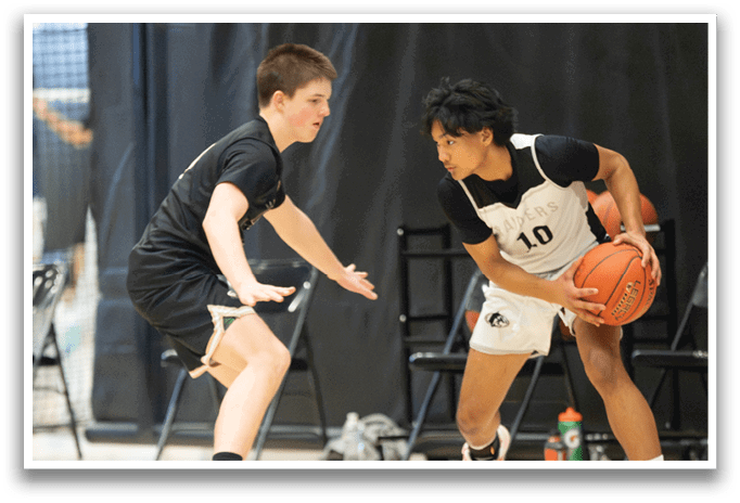 Two boys playing basketball, one with a ball and the other trying to block him. AI generated content