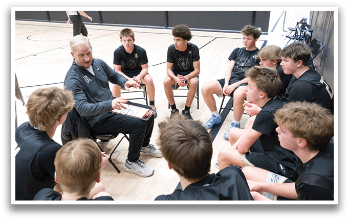 A group of young men are gathered in a gym, engaged in a discussion. AI generated content