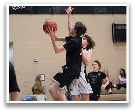 Two basketball players jumping for the ball. AI generated content