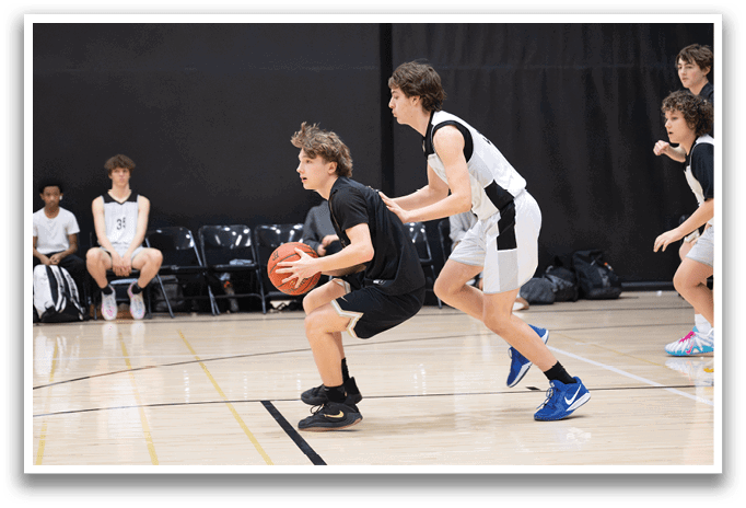 A group of young men playing basketball, one of them holding a basketball. AI generated content