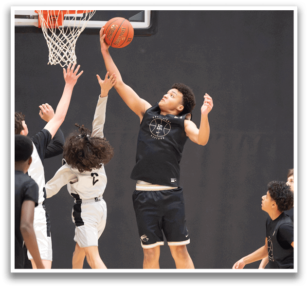A group of young men playing basketball, with one man jumping to block a shot. AI generated content