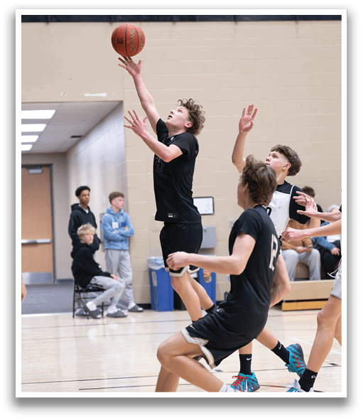A basketball player is jumping to catch a ball in a gym. AI generated content