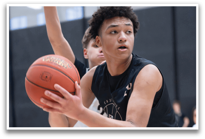 Two men playing basketball, one holding a basketball in his hand. AI generated content