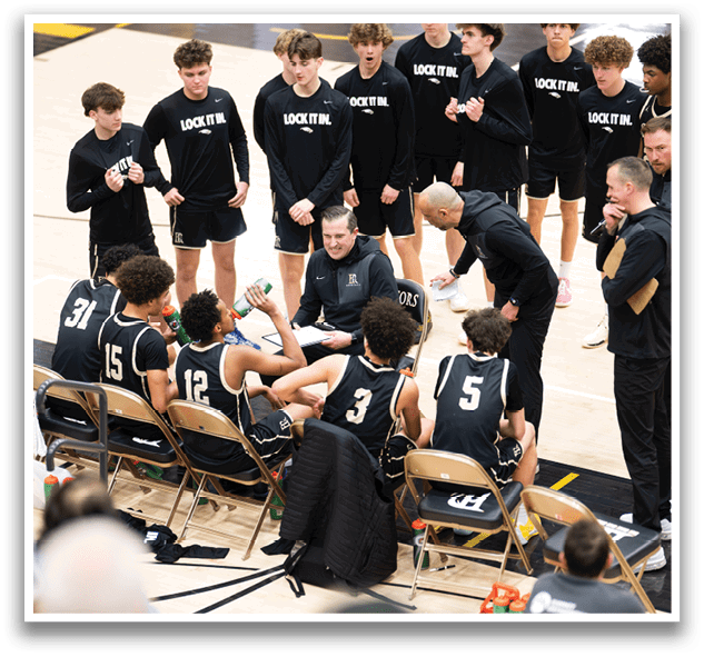 A group of young men are sitting on chairs on a basketball court. AI generated content
