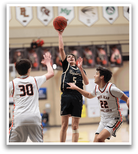 A basketball player is jumping to grab the ball while two other players try to block him. AI generated content
