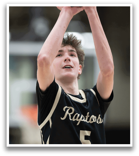 A basketball player in a black and gold jersey with the number 5 on it is holding a basketball in his hands, preparing to shoot. AI generated content