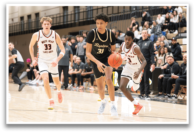 A basketball game is in progress with a player running with the ball. AI generated content