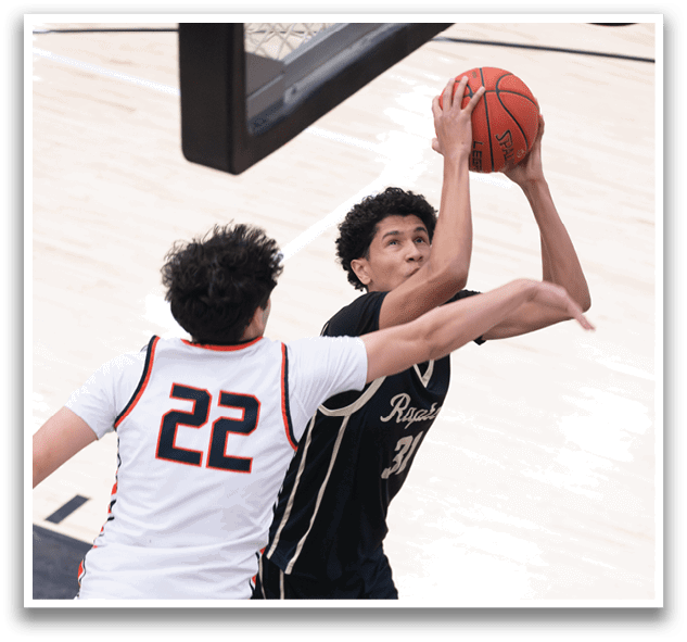 Two basketball players are playing for a rebound, with one player holding the ball and the other trying to block him. AI generated content