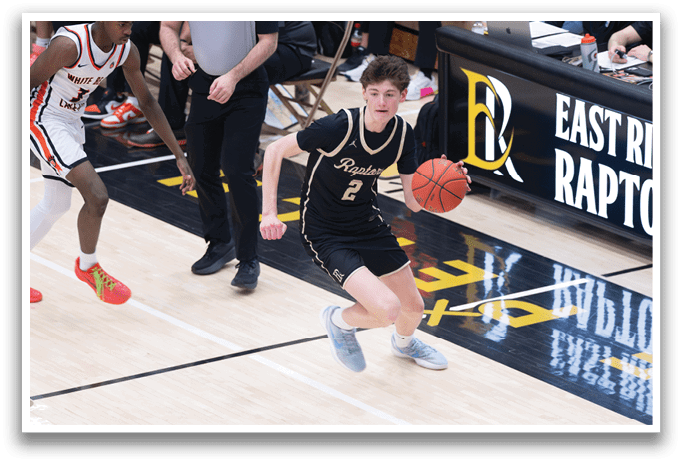 A basketball player in a black and gold uniform is running with a basketball in his hands. AI generated content