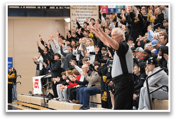 A referee stands in front of a crowd of people, some of whom are holding up their hands. AI generated content