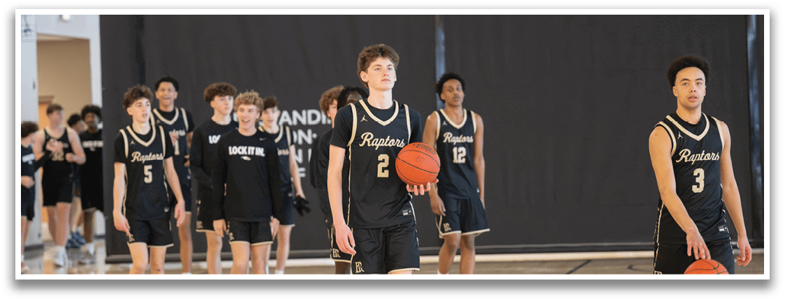A group of basketball players wearing black and gold uniforms are walking on a basketball court. AI generated content