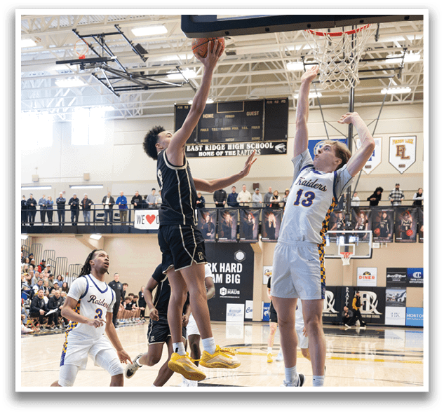 Basketball players in action on a court, one player leaps to block a shot. AI generated content