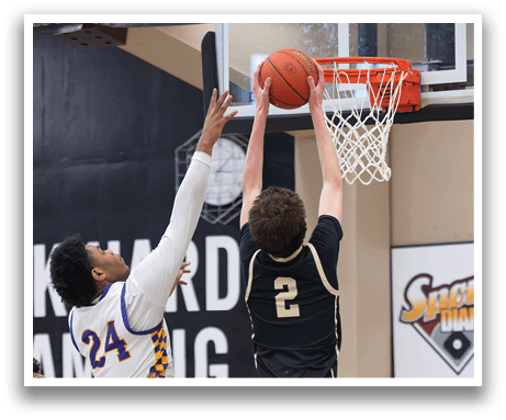 Two basketball players are leaping for the same ball, with one player wearing a number 2 jersey. AI generated content