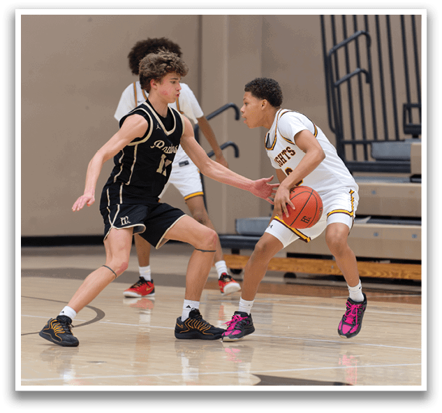 Two basketball players are playing on a court, one wearing a black jersey and the other wearing a white jersey. The black player is trying to block the white player from getting the ball. AI generated content