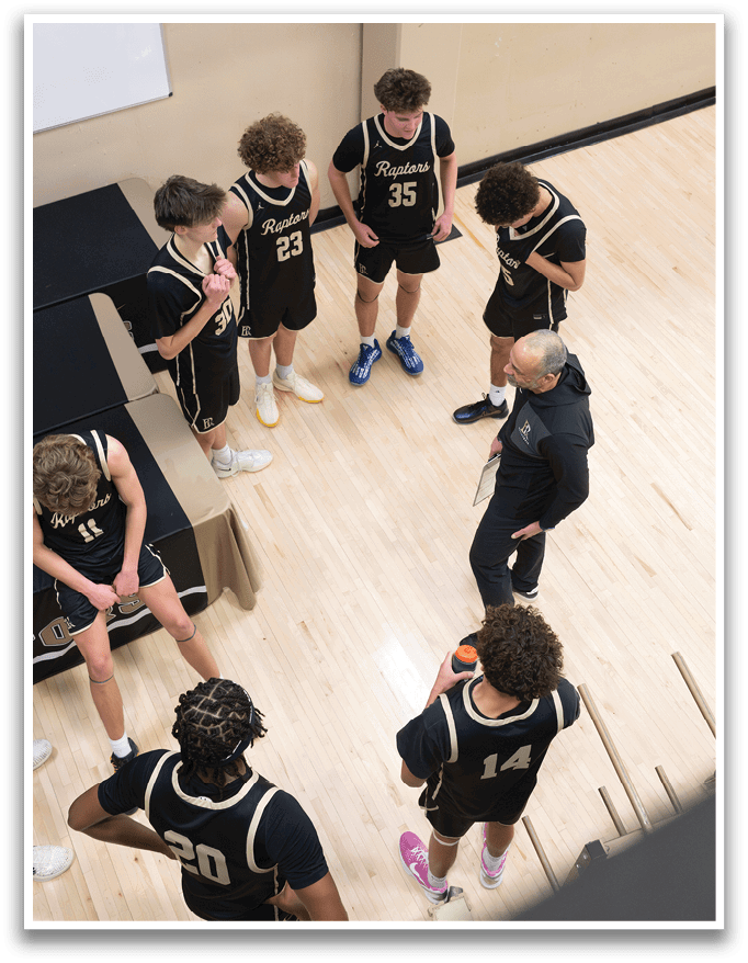 A group of young men wearing basketball uniforms are standing in a circle on a basketball court. AI generated content