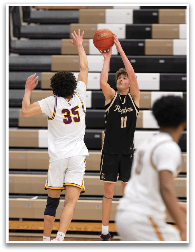 Two basketball players are playing on a court, one of them is holding a basketball. AI generated content