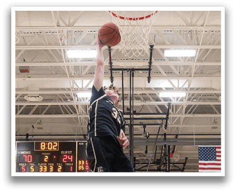 A basketball player is jumping to hit the ball in a game. AI generated content