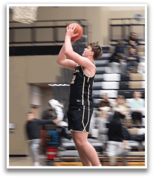A basketball player leaps into the air to catch a ball. AI generated content
