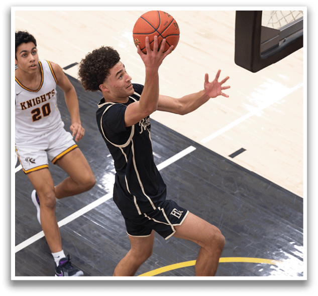 A basketball player in a black and gold uniform is jumping up to catch a basketball. AI generated content