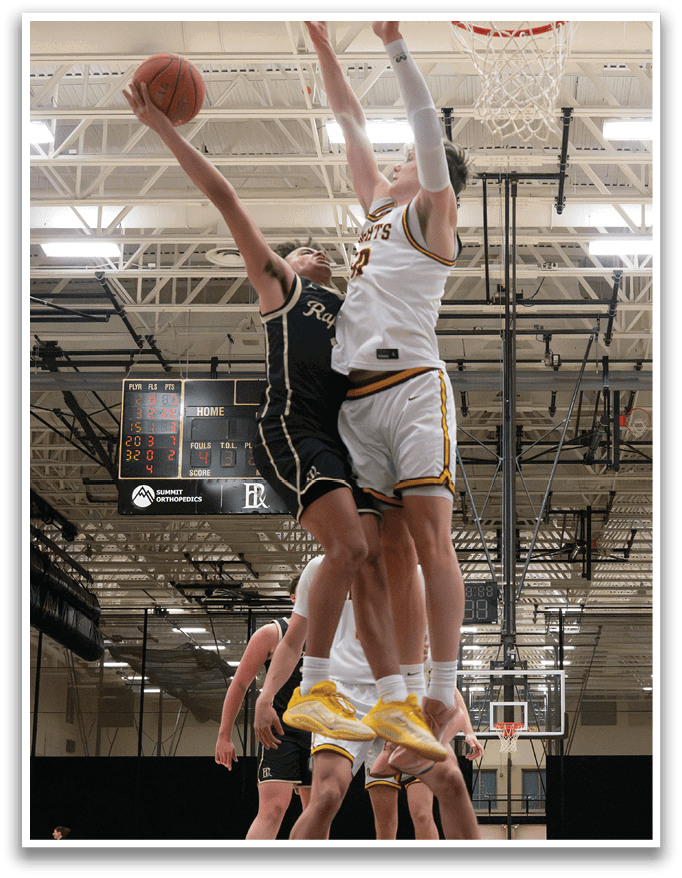 Basketball players on a court, one of them jumping to block a shot. AI generated content