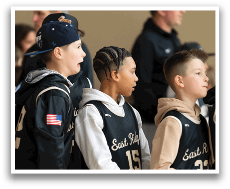 A group of young boys wearing basketball jerseys and hats are standing together. AI generated content
