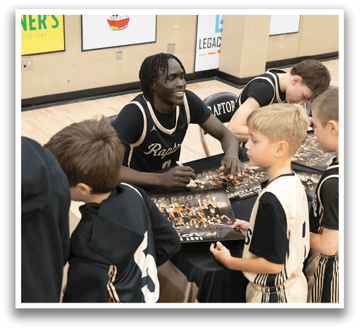A group of young boys are gathered around a table, getting autographs from a man. AI generated content