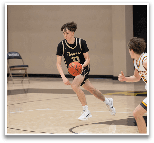 Two basketball players are running on the court, one holding a basketball. AI generated content