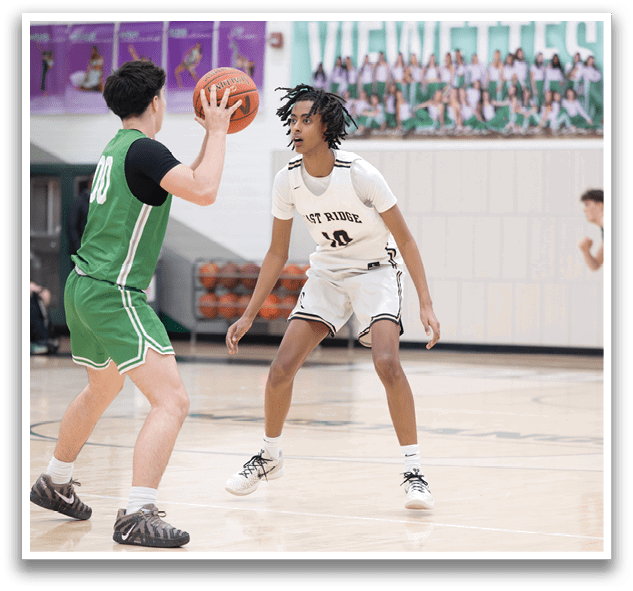 Two basketball players on a court, one holding a basketball. AI generated content