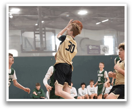 A basketball player jumps to block a shot. AI generated content