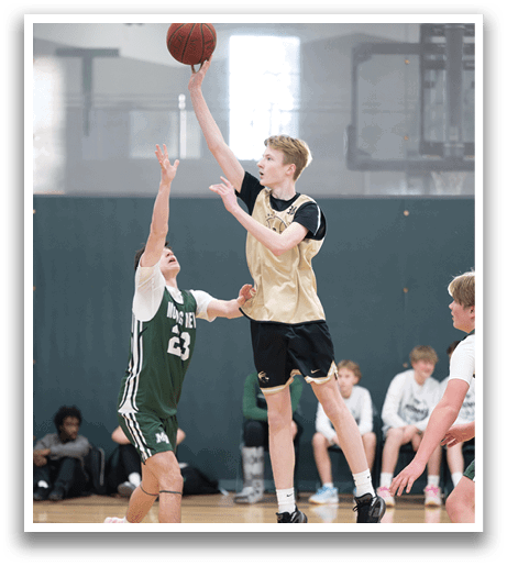 A boy in a basketball game is jumping to catch the ball. AI generated content
