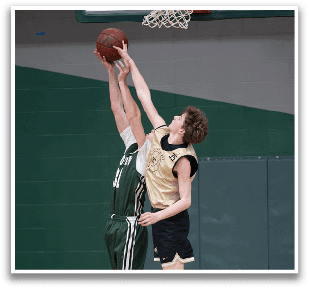 Two basketball players jumping for the ball, one with a green jersey and the other with a gold jersey. AI generated content