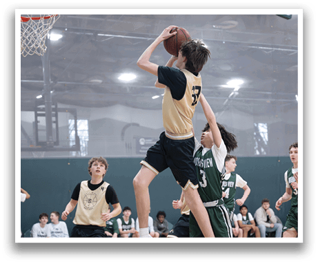 A basketball player leaps to block a shot, while other players look on. AI generated content