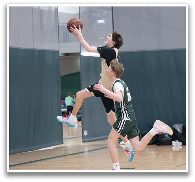 Two men playing basketball, one jumping to catch the ball. AI generated content