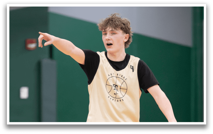 A young man wearing a basketball jersey is pointing to the ground. AI generated content