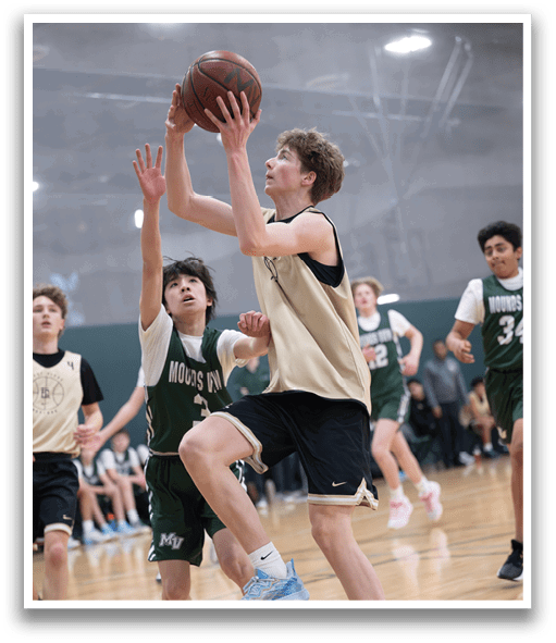 Two boys playing basketball, one with a basketball in his hands. AI generated content
