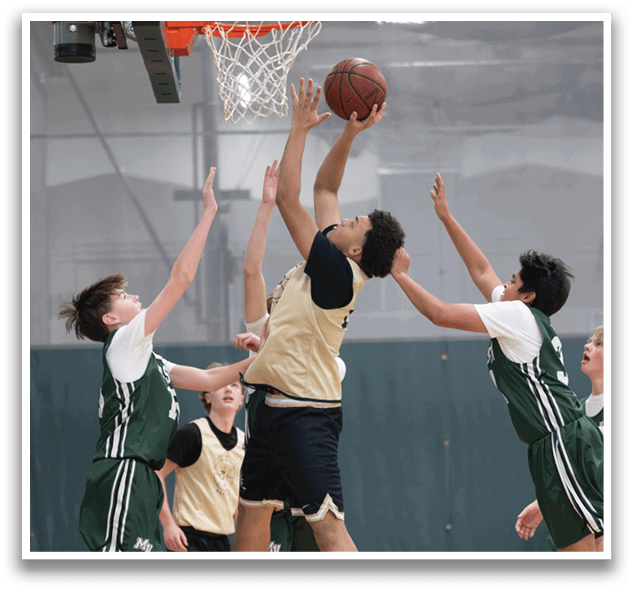 A group of young men playing basketball, with one player jumping up to grab the ball. AI generated content