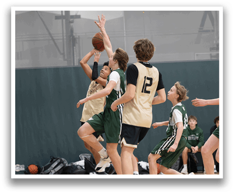 A group of young men playing basketball on a court. AI generated content