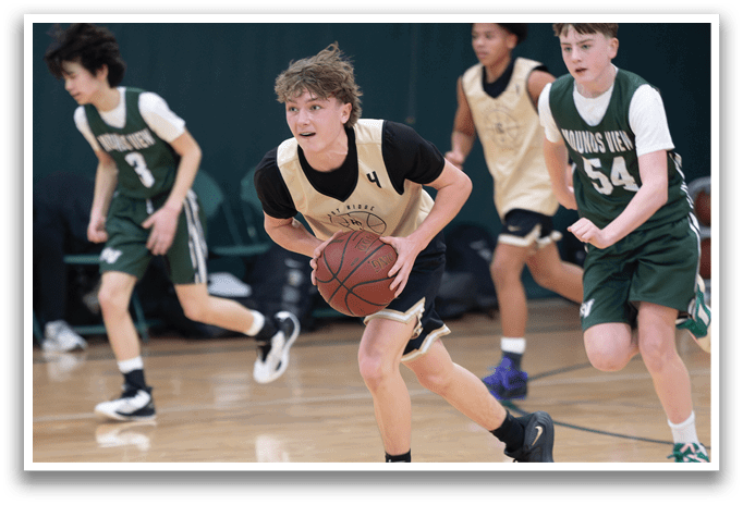 A group of young men playing basketball on a court. One of the players is holding a basketball. AI generated content