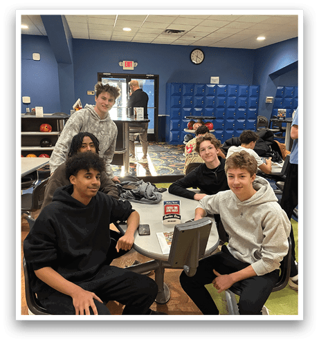 A group of young men are sitting around a table in a bowling alley, playing video games. AI generated content