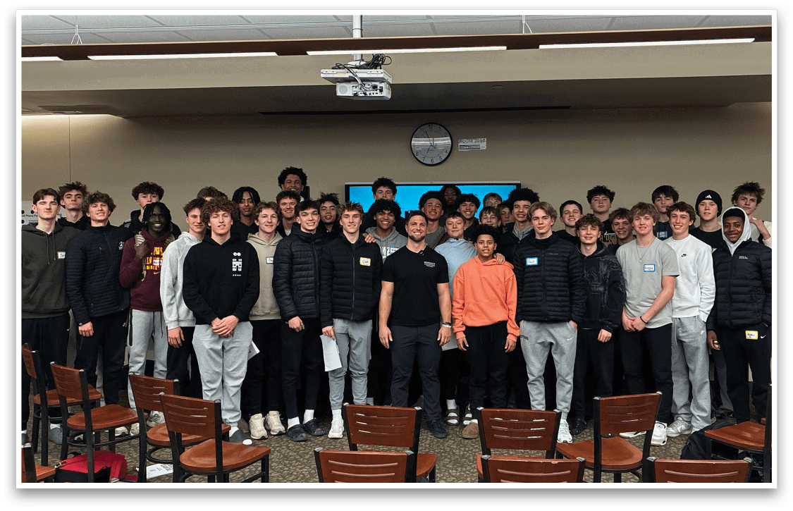 A group of young men pose for a picture in a classroom. AI generated content