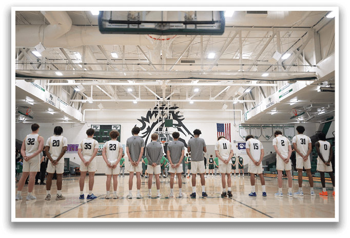 A group of young men are standing on a basketball court, wearing uniforms and waiting for the game to start. AI generated content