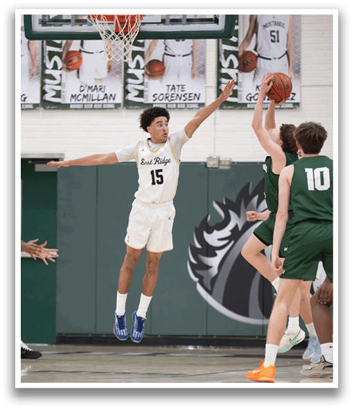 A basketball player jumps in the air to block a shot. AI generated content