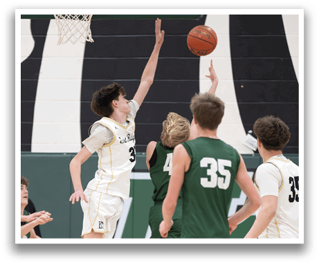 Basketball players on a court, one of them jumping to block a shot. AI generated content