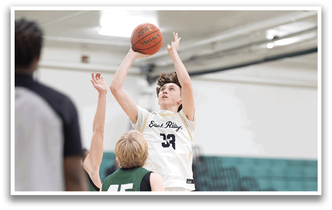 A basketball player is jumping to block a shot, while another player is trying to score. AI generated content