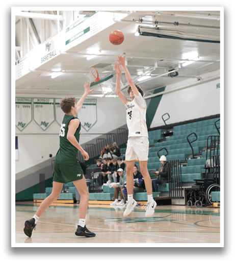 Two men are playing basketball on a court, one of them is jumping to hit the ball. AI generated content
