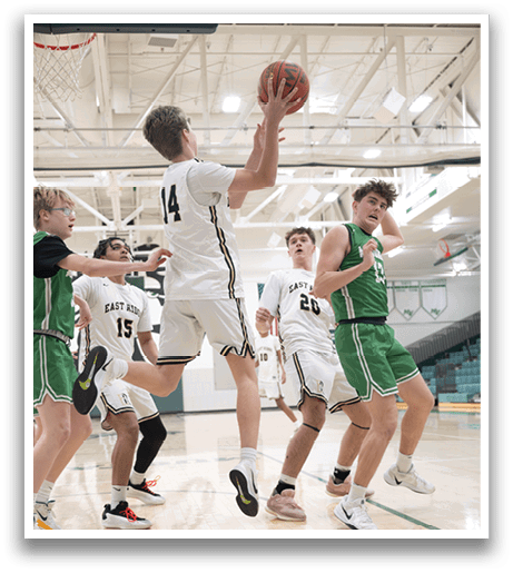 A group of basketball players on a court, one of them jumping to block a shot. AI generated content