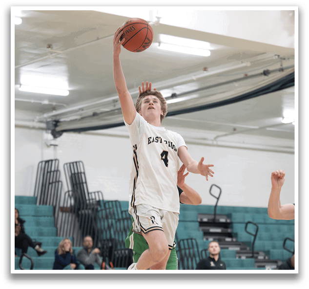 A basketball player leaps in the air to catch a ball. AI generated content