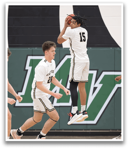 A basketball player jumps in the air to block a shot. AI generated content