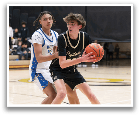 Two basketball players on a court, one with a blue shirt and the other with a black shirt. The player in the blue shirt is holding a basketball. AI generated content
