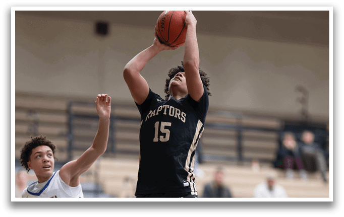 A basketball player in a black and gold jersey leaps into the air to shoot a basket. AI generated content